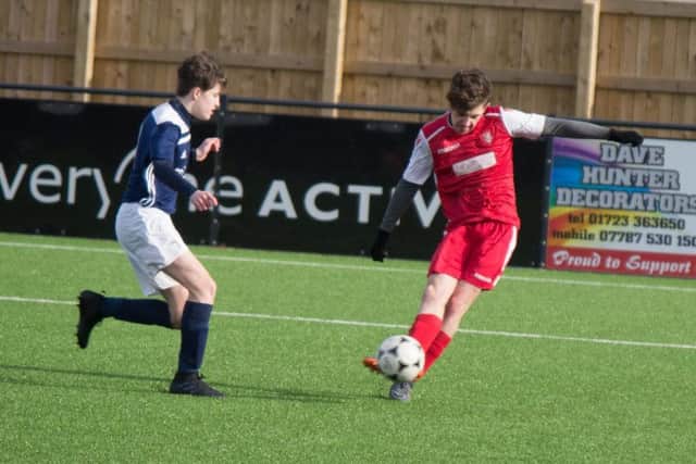 Marcus OFlanagan gets a strike in on the Sproatley goal. Picture by Steve Lilly.