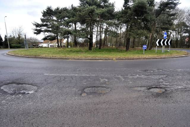 Pot holes on Scarborough's A64 . Examples of road damage on the A64