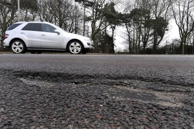 Pot holes on Scarborough's A64 . Examples of road damage on the A64