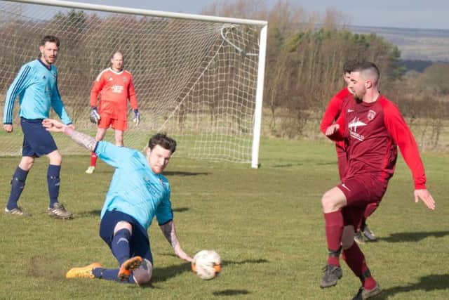Castle Tavern's George Elliott makes a slide tackle against Angel Reserves


Picture by Steve Lilly