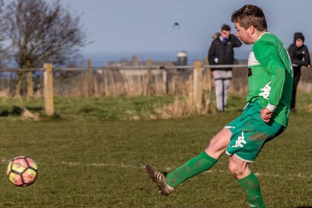Captain Luke Storr slots home his penalty in the 4-2 shoot-out win
