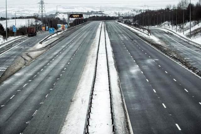 The M62 has been closed for most of the night and will remain shut today as high winds and snow cause havoc. Picture PA