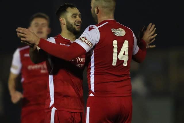 Luke Dean celebrates a goal