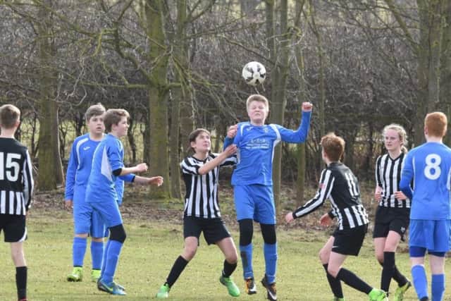 Heslerton Under-14s (blue kit) beat Dunnington 5-4