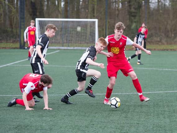 George Bramham tussles for possession in midfield with teammate Nathan Parker looking on during Boro Under-16s 3-0 defeat   Pictures by Andy Standing