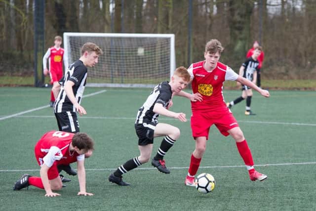 George Bramham tussles for possession in midfield with teammate Nathan Parker looking on during Boro Under-16s 3-0 defeat Pictures by Andy Standing