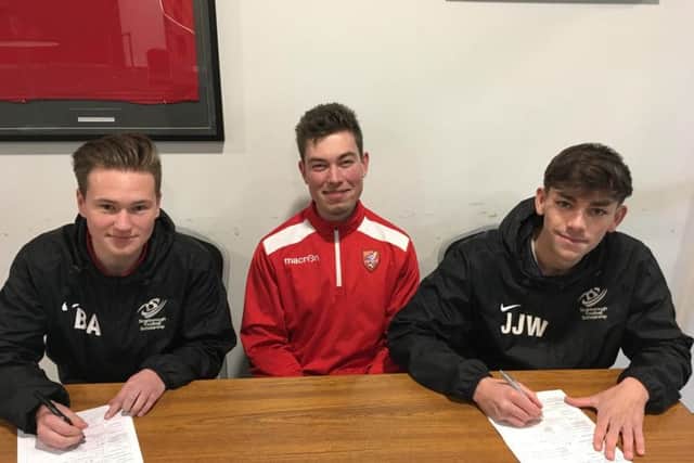 Two of the Scholarship players sign on
