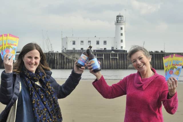 Wold Top Brewery Manager Kate Balchin and Books by the Beach organiser Heather French.