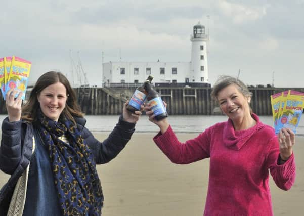 Wold Top Brewery Manager Kate Balchin and Books by the Beach organiser Heather French.