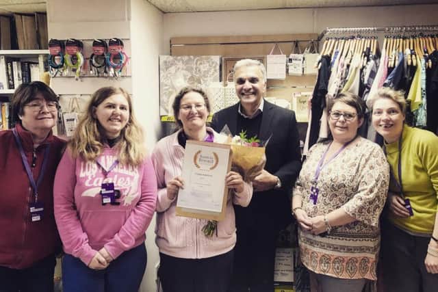 Lisa Dixon is presented with her award by Scopes director of operations Ricky Mohindra.