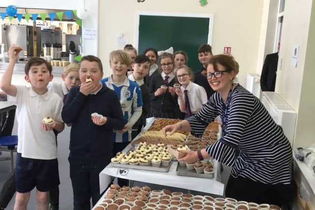 Gemma Carabine sells cakes and biscuits to the Year 6 pupils at Northstead School.