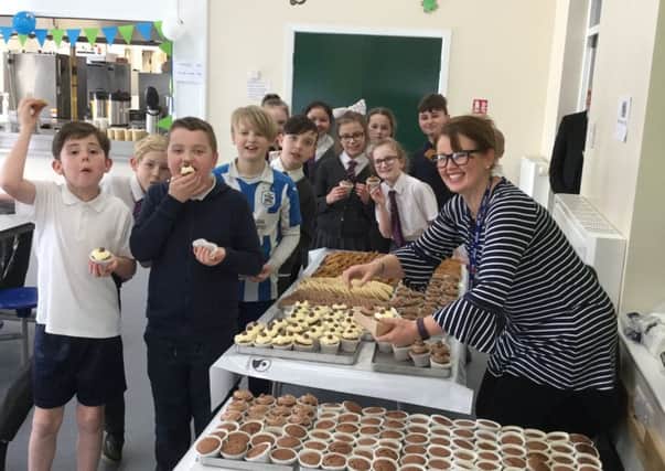 Gemma Carabine sells cakes and biscuits to the Year 6 pupils at Northstead School.