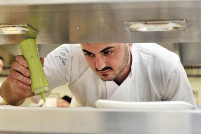 Scarborough Tec on Filey road hosts a special evening of food and drink prepared by top local chefs and Tec students.Ash Bower puts the finishing touches to the dish . . pic Richard Ponter 181117e