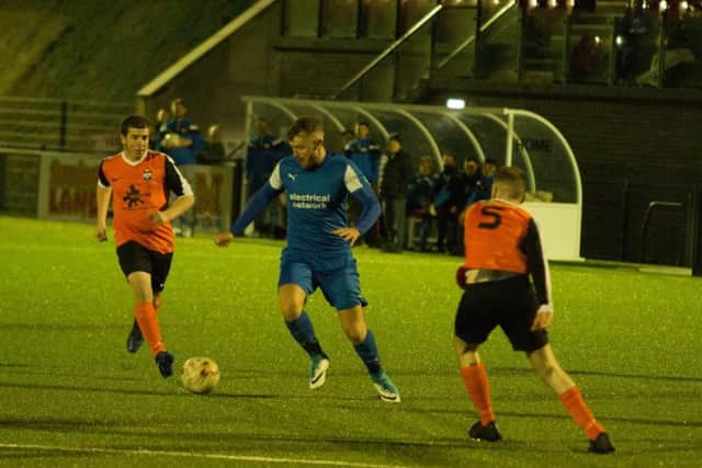 Traf, blue kit, take on Ayton