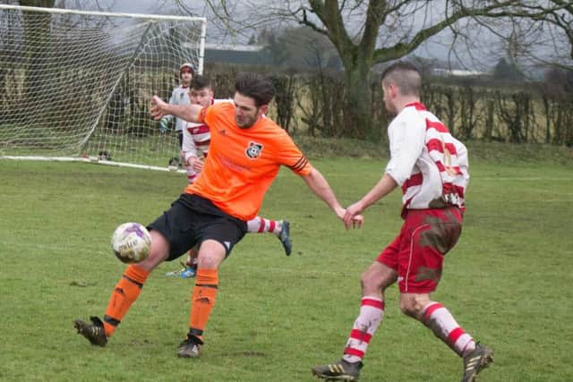 Snainton on the ball against Cayton. Pictures by Steve Lilly.