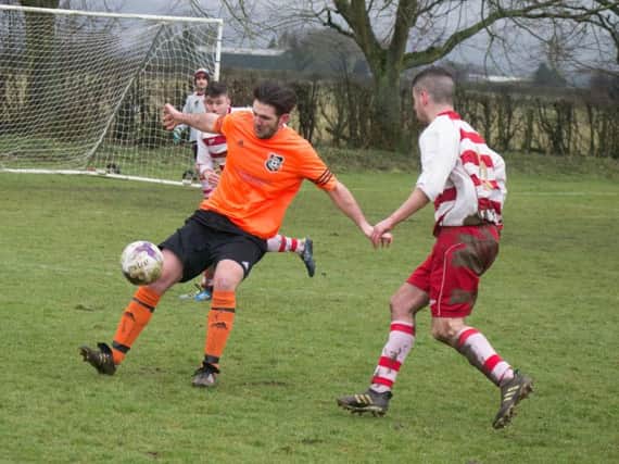 Snainton on the ball against Cayton. Pictures by Steve Lilly.