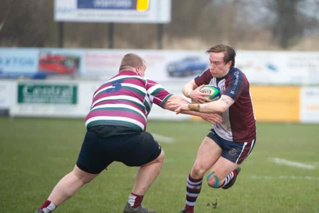 Jordan Wakeham on his way to scoring a second try of the day for Scarborough RUFC