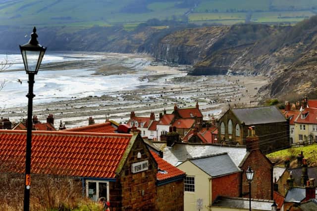 030418 The red roofs of Robin Hoods Bay on the Yorkshire coast . Pic Post/Countyweek. Picture taken on a Nikon D3s camera witha 70-200mm lens at 116 mm with an exposure of 1\100pth sec af f10 with an ISO of 400.