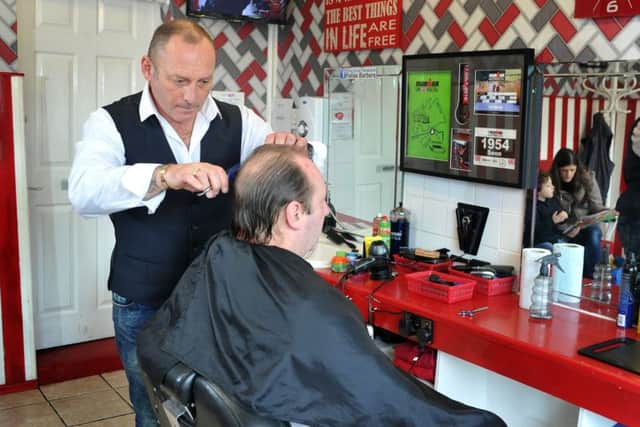 Seon Martin at work at Fella's Barbers