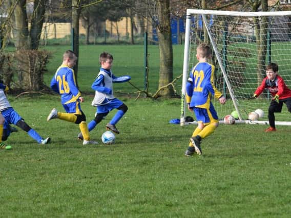Logan Tuck scores Filey Holts first goal