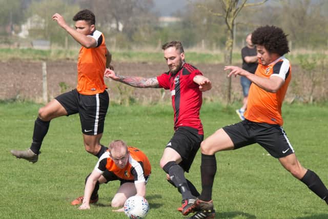 West Pier's Martin Cooper pushes up against Edgehill Picture by Steve Lilly