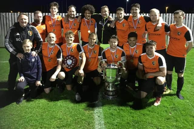 Edgehill line up with the League Cup after their 3-2 win against West Pier