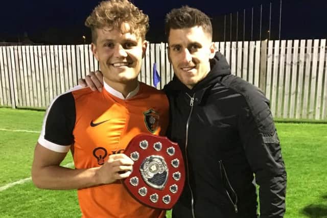Michael Coulson presents the Steve Coulson Memorial Man of the Match Award to Edgehill winger Jackson Jowett