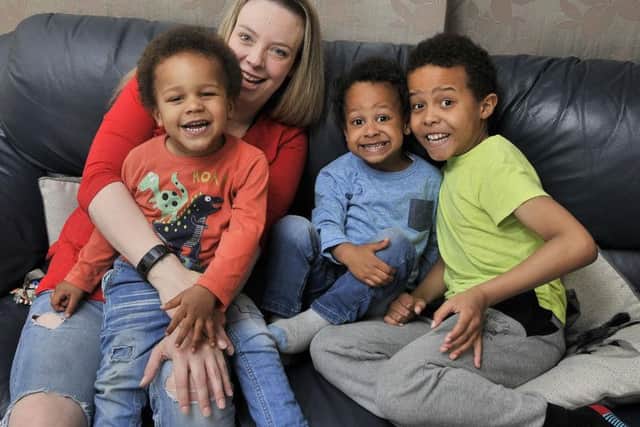 Kieran Dube (4) with Mum Rachel Dube and brothers Christian (2) and Ryan (9) .