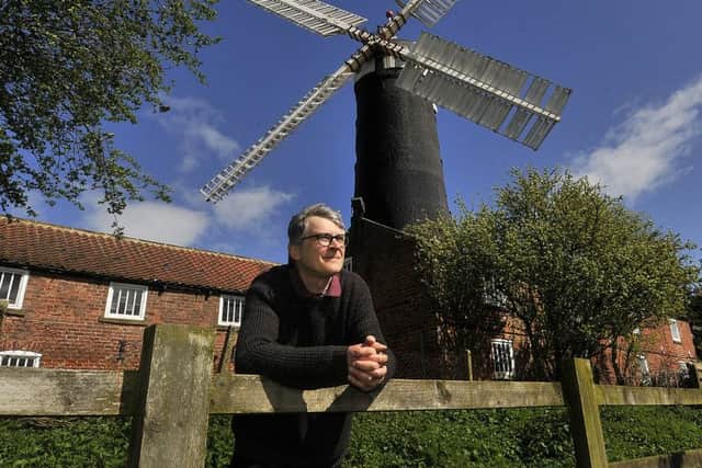 Skidby Mill windmill . Curator Richard Young at the mill