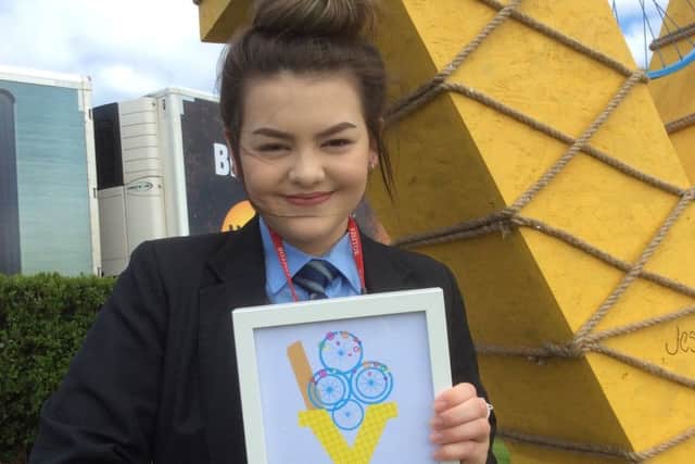 Jess Wallace with her certificate after winning the competition.