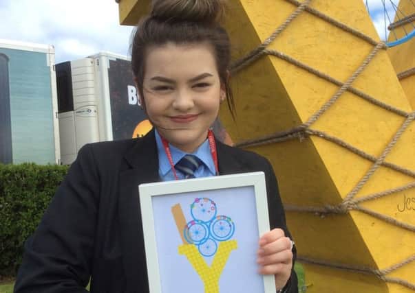 Jess Wallace with her certificate after winning the competition.