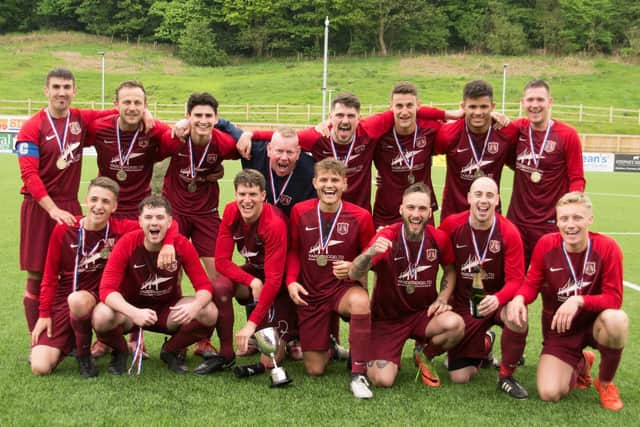 Angel show off their medals and Scarborough FA Sunday Cup