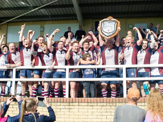 Scarborough RUFC captain Matty Jones lifts the Yorkshire Shield. Picture by Andy Standing.