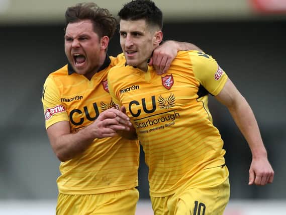 Jamie Price celebrates with Michael Coulson