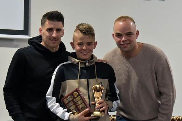 Harvey Bayes with his Under-12s Players Player Award