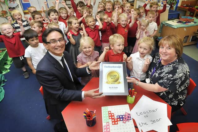 Last years Teacher of the Year winner Mrs Chalk with her certificate presented by editor Ed Asquith.