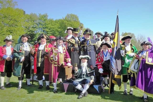 The town criers pose for a photo at the Haslemere competition.