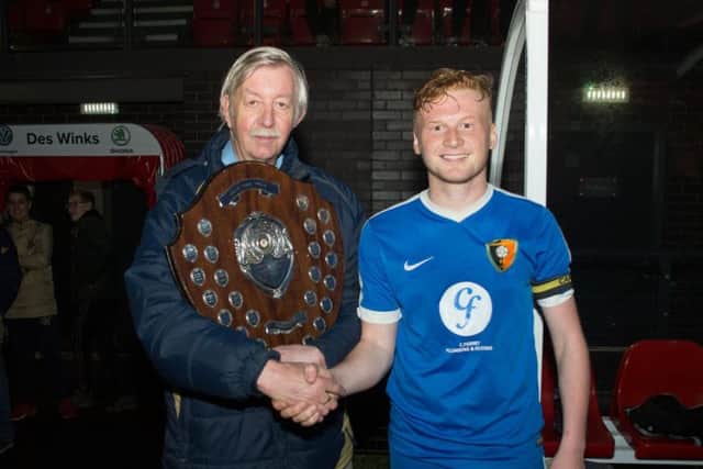Edgehill skipper Tyler Richardson with Mick Stephenson from the league committee