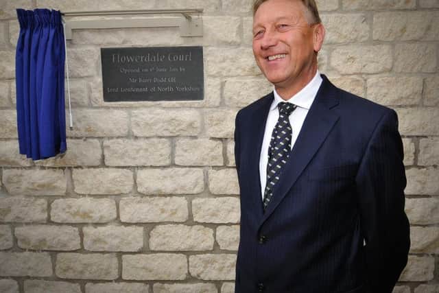 Her Majesty's Lord-Lieutenant for North Yorkshire, Mr Barry Dodd unveils a plaque in Seamer