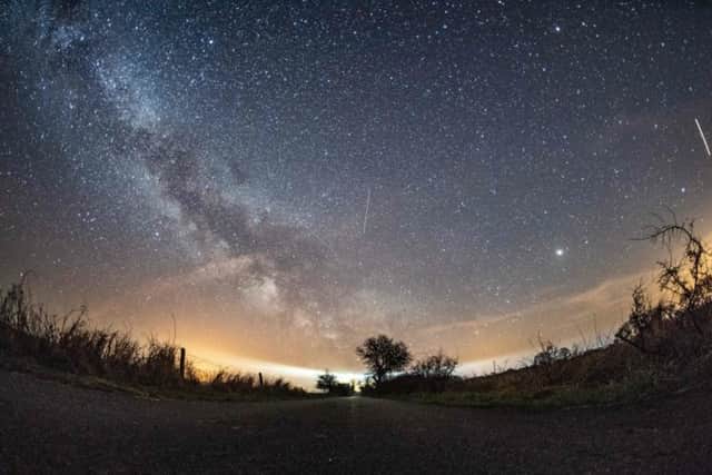The milky way and meteors of the April Lyrids annual meteor shower (Photo: Daniel Reinhardt/AFP/Getty Images)